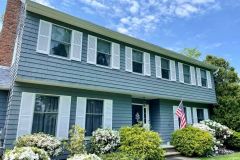 House on Long Island painted gray with white trim and shutters by Long Island Professional Painters-1