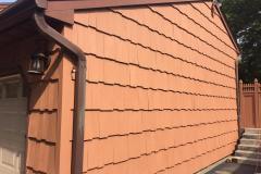 Painter in Northport New York restores an entire exterior of a house by staining it cedar