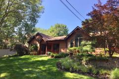 Painter in Northport New York restores an entire exterior of a house by staining it cedar