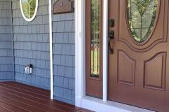 House stained blue, door stained brown and deck refinished by painters Long Island