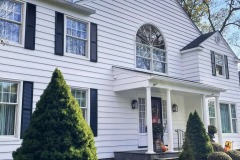 Home painted white with black trim in Nissequogue New York by Suffolk County Painters