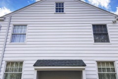 Home painted white with black trim in Nissequogue New York by Suffolk County Painters