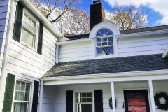 Home painted white with black trim in Nissequogue New York by Suffolk County Painters