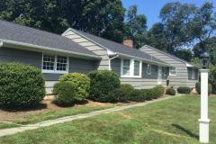 House painted gray with white trim by Suffolk County NY painter