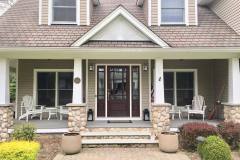 Suffolk County painters paint New York homebuyer home tan with white trim and brown door.