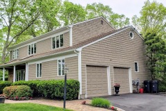 House painted tan with white trim by Long Island House Painting company American Made Painting