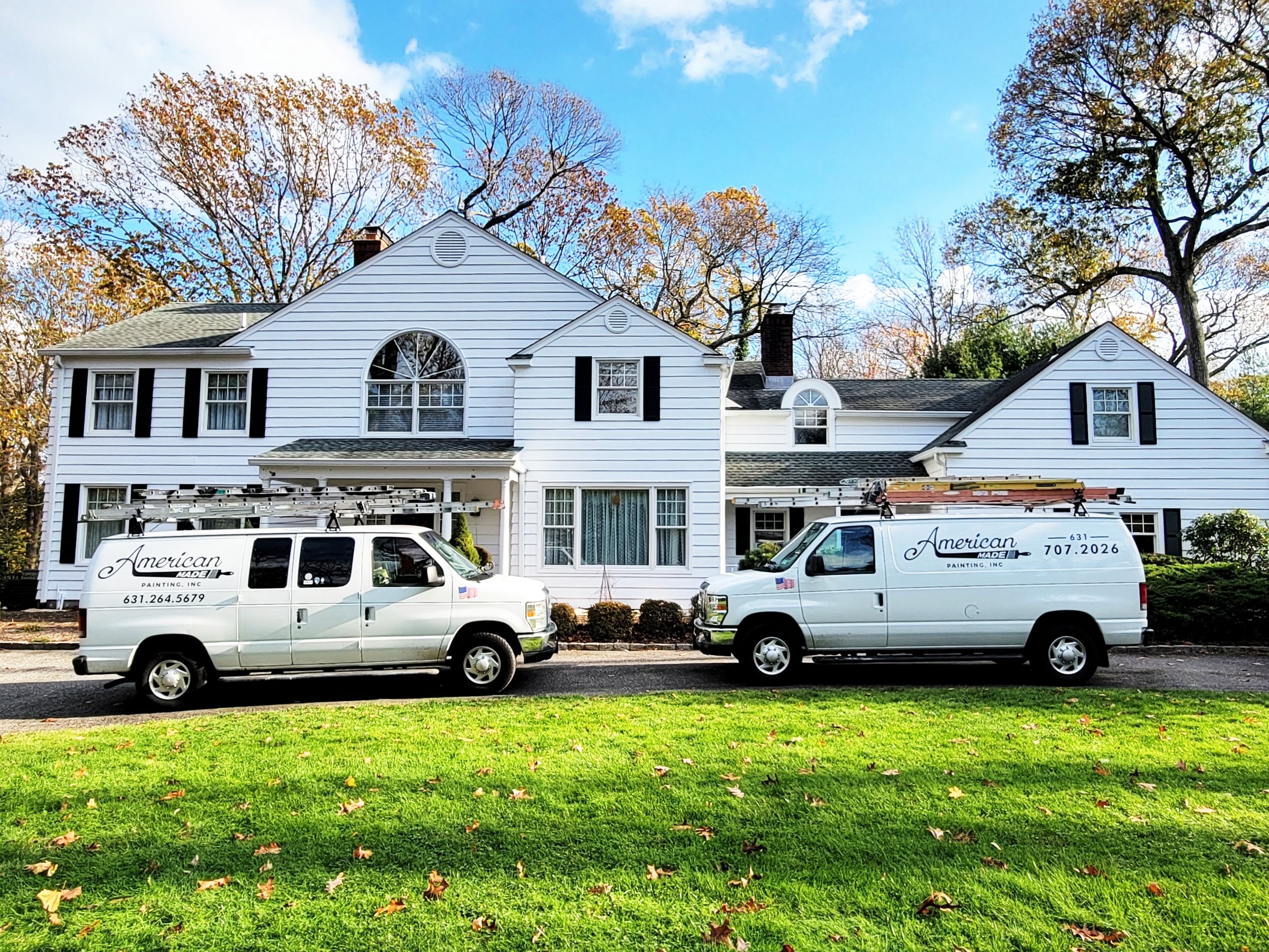 Two Long Island Painter vans out front of a Nissequogue, New York home.